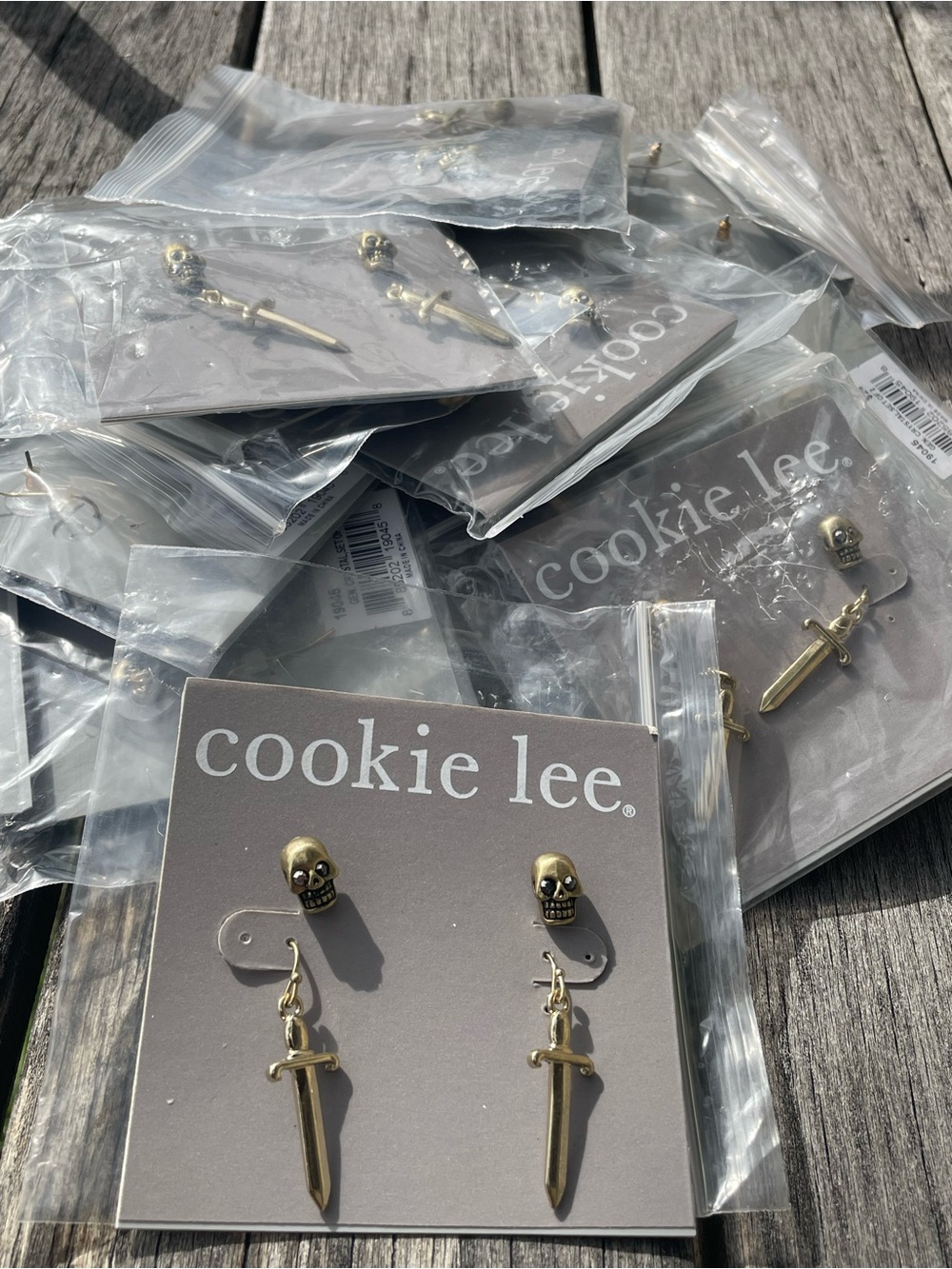 Lot of new Cookie Lee Gold Skull Studs with Dangling Dagger Earrings reseller